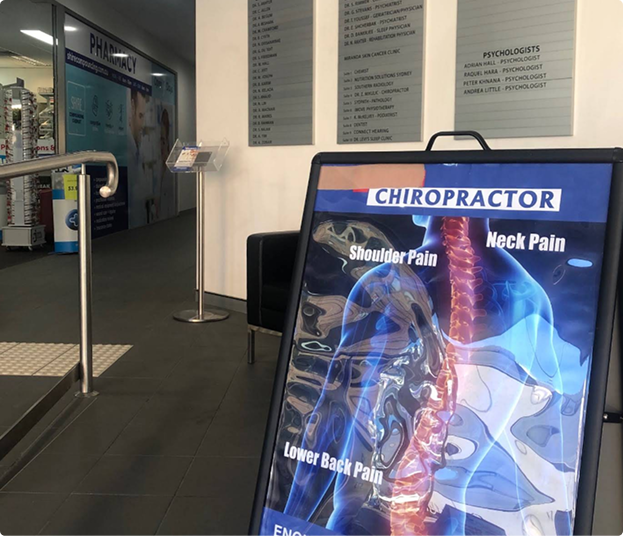 Reception area of Miranda Wholistic Health Centre with chiropractic care signage