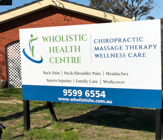 Sign for Kareela Wholistic Health Centre offering chiropractic, massage, and wellness care